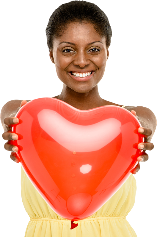 Smiling woman holding a red heart-shaped ballon.