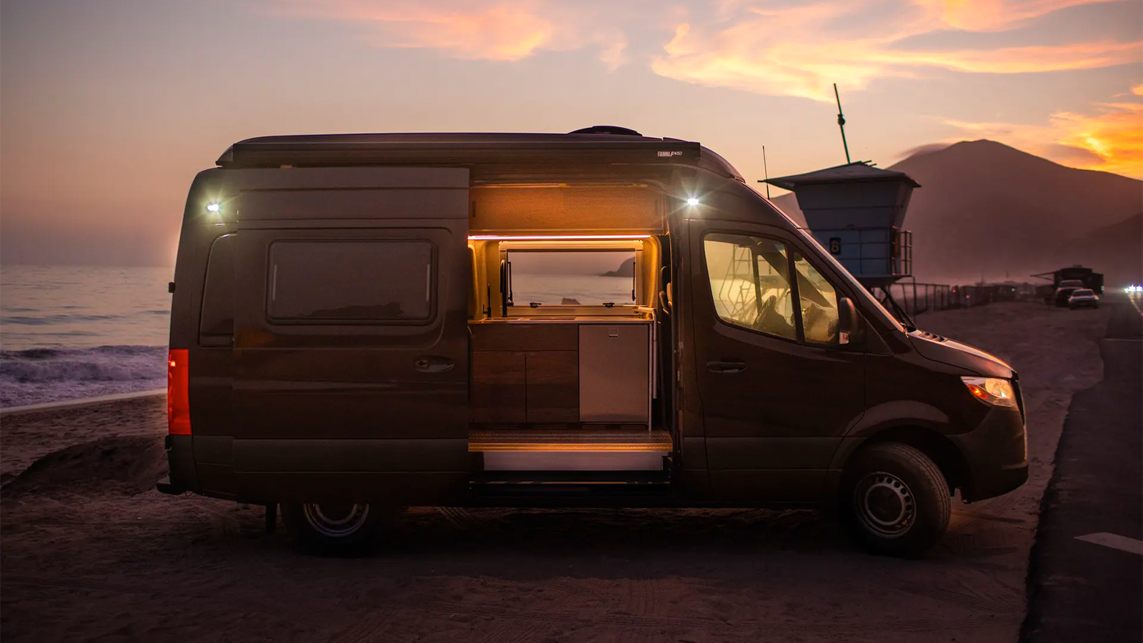 Texino RV parked at beach at sunset.